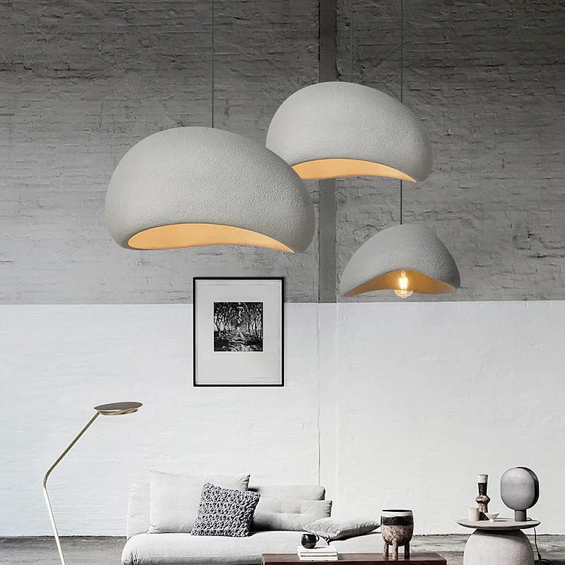 Two white dome pendant lights beside a floor lamp