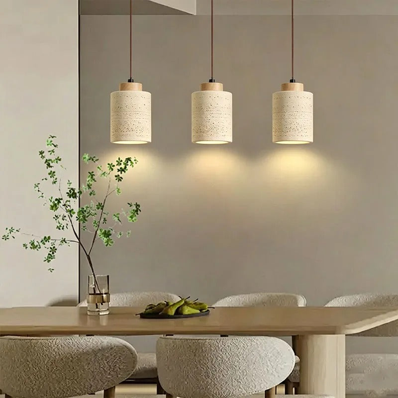Row of yellow stone pendant lights switched on