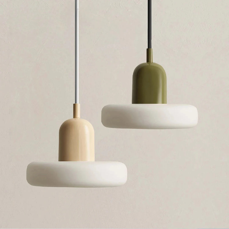 Two cream glass saucer pendant lights with coloured tops