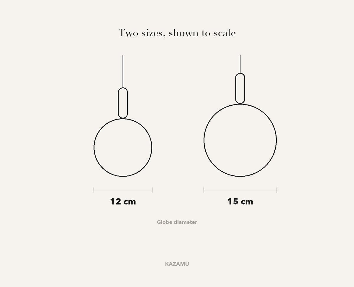 Size comparison — 12 cm and 15 cm marble globe, drawn to scale