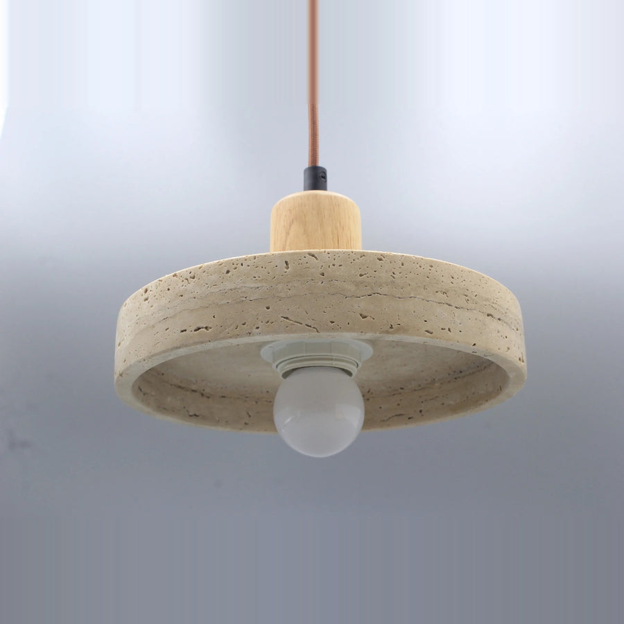 Stone disc pendant light with a light wood-tone top, seen from below