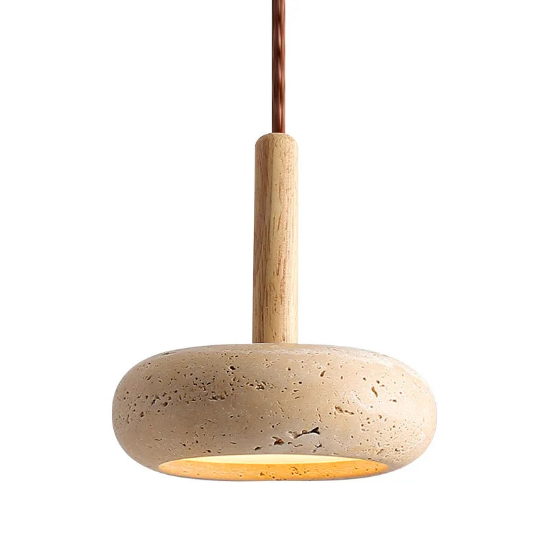 Close-up of the travertine disc shade and wood stem
