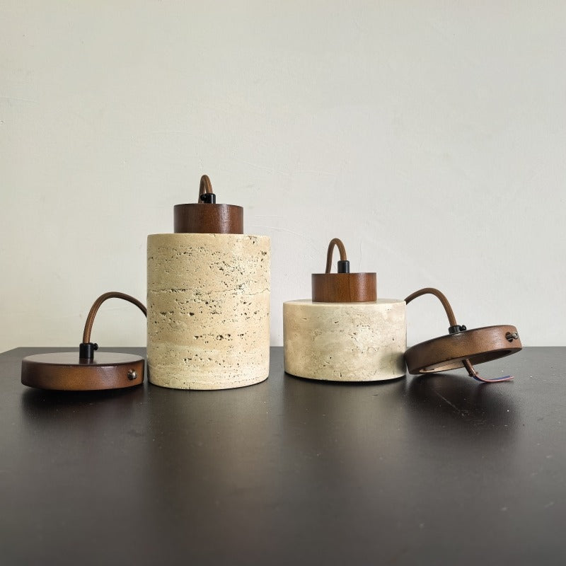 Travertine stone pendant shades in both sizes with walnut-coloured ceiling trays