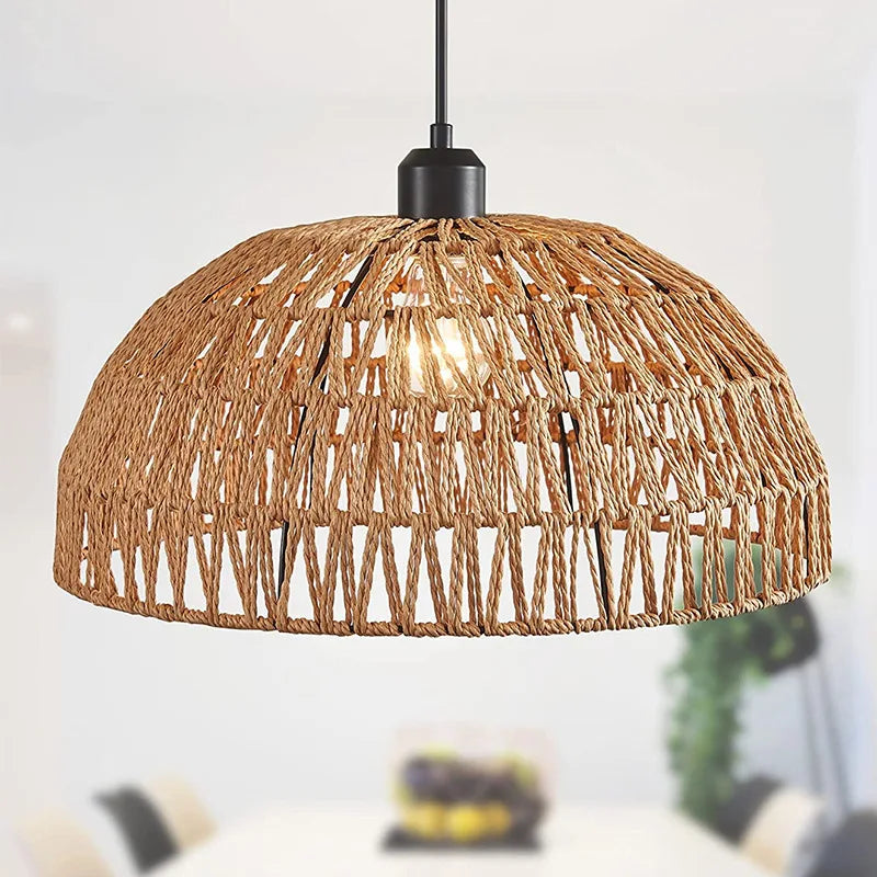 Woven rope dome pendant light in natural, lit, over a dining area