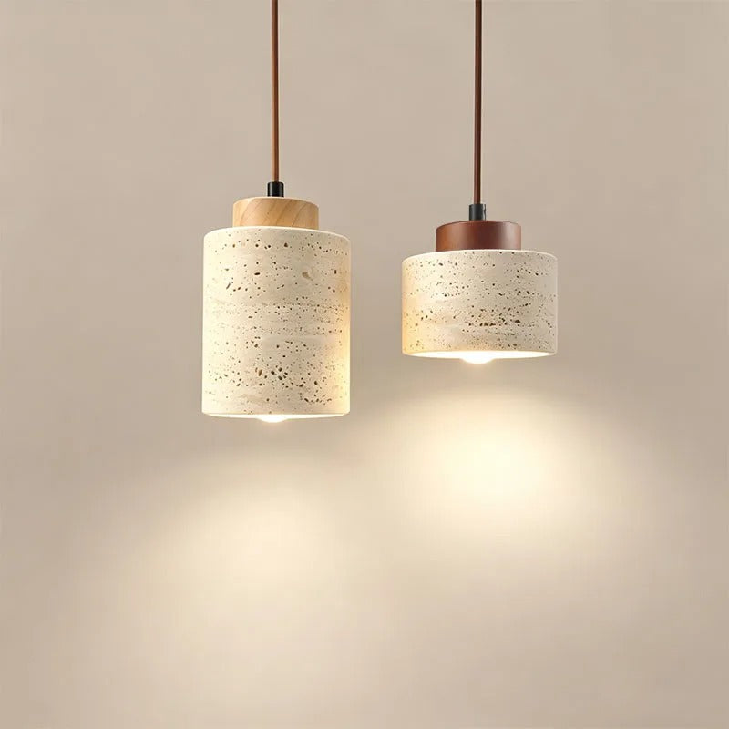 Two yellow stone cylinder pendant lights with wood-tone tops